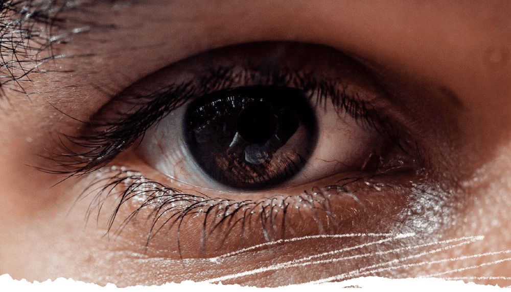 Featured image, close-up of an eye, belonging to a person of color.