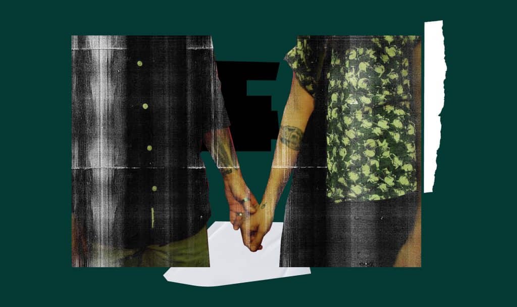 Two genderqueer people with white skin, holding hands.